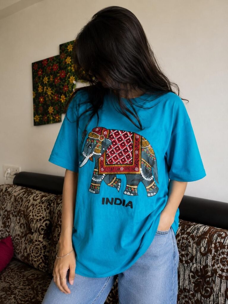 Peacock Blue Tee – Graphic Handprint Elephant Edition
